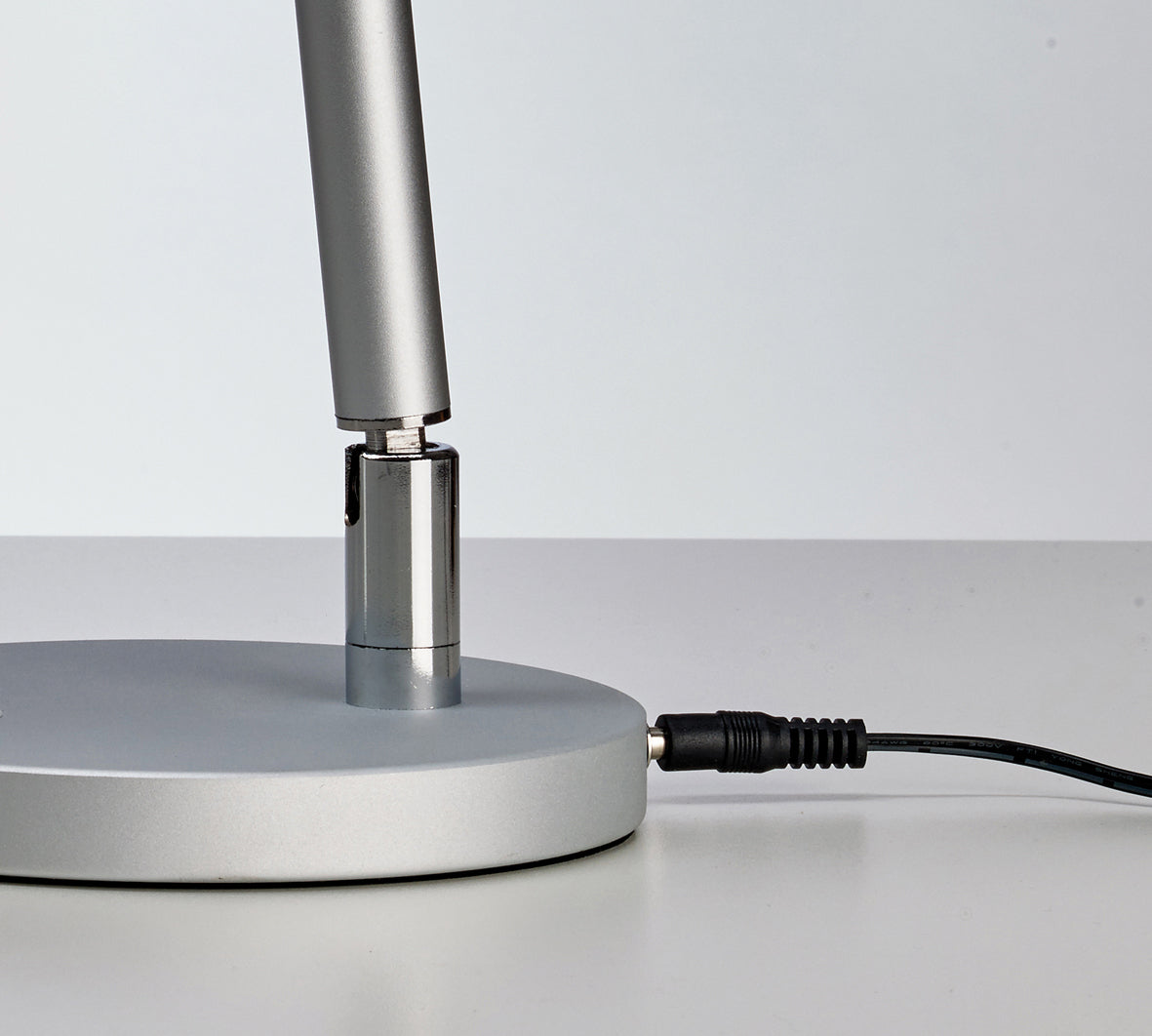 Beauty System PROMED LTL-749 LED table lamp with non-shadow lighting on a modern desk or bedside table.