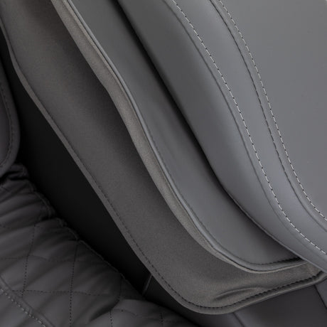 Sakura Maximus 3D Sakura massage chair in white and grey with ergonomic design and padded armrests for relaxation.