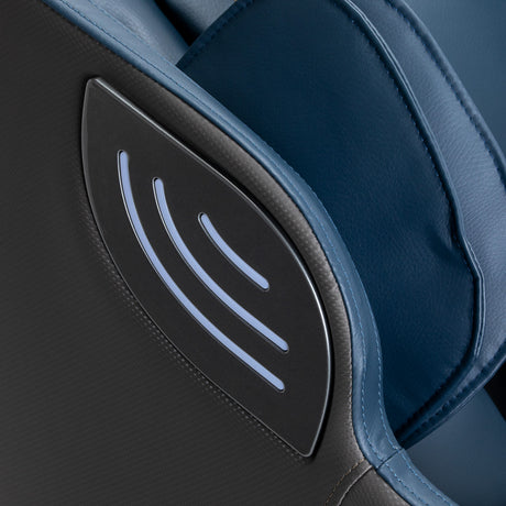 Sakura 3D Sakura Maximus 809 massage chair in grey-blue with padded armrests and control panel, designed for full-body relaxation.