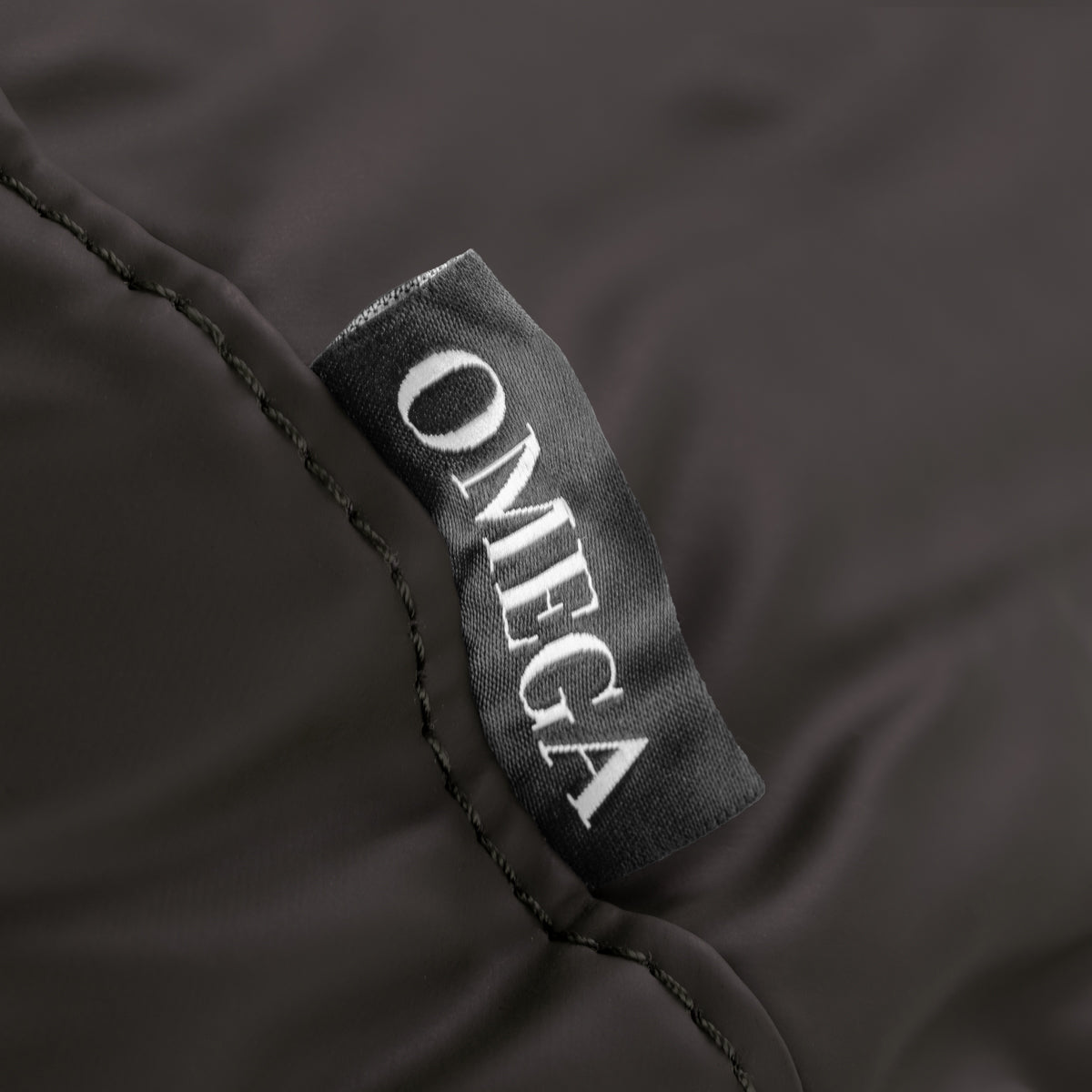 Omega brown headrest for hairdressing wash unit, cushioned support with adjustable design for salon comfort.