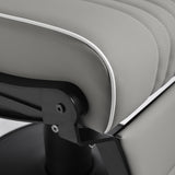 Gabbiano Levi barber chair in grey with black frame, featuring padded seat and backrest, for professional barbershop use.