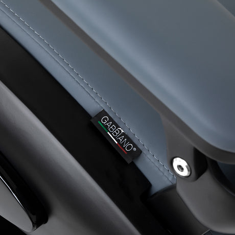 Gabbiano Francesco Graphite barber's chair with black base, featuring padded armrests and adjustable height for professional grooming.