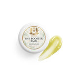 Skin Monarch Ink Booster Balm 30ml, kaas läikiva kollase palsami määrde kõrval
