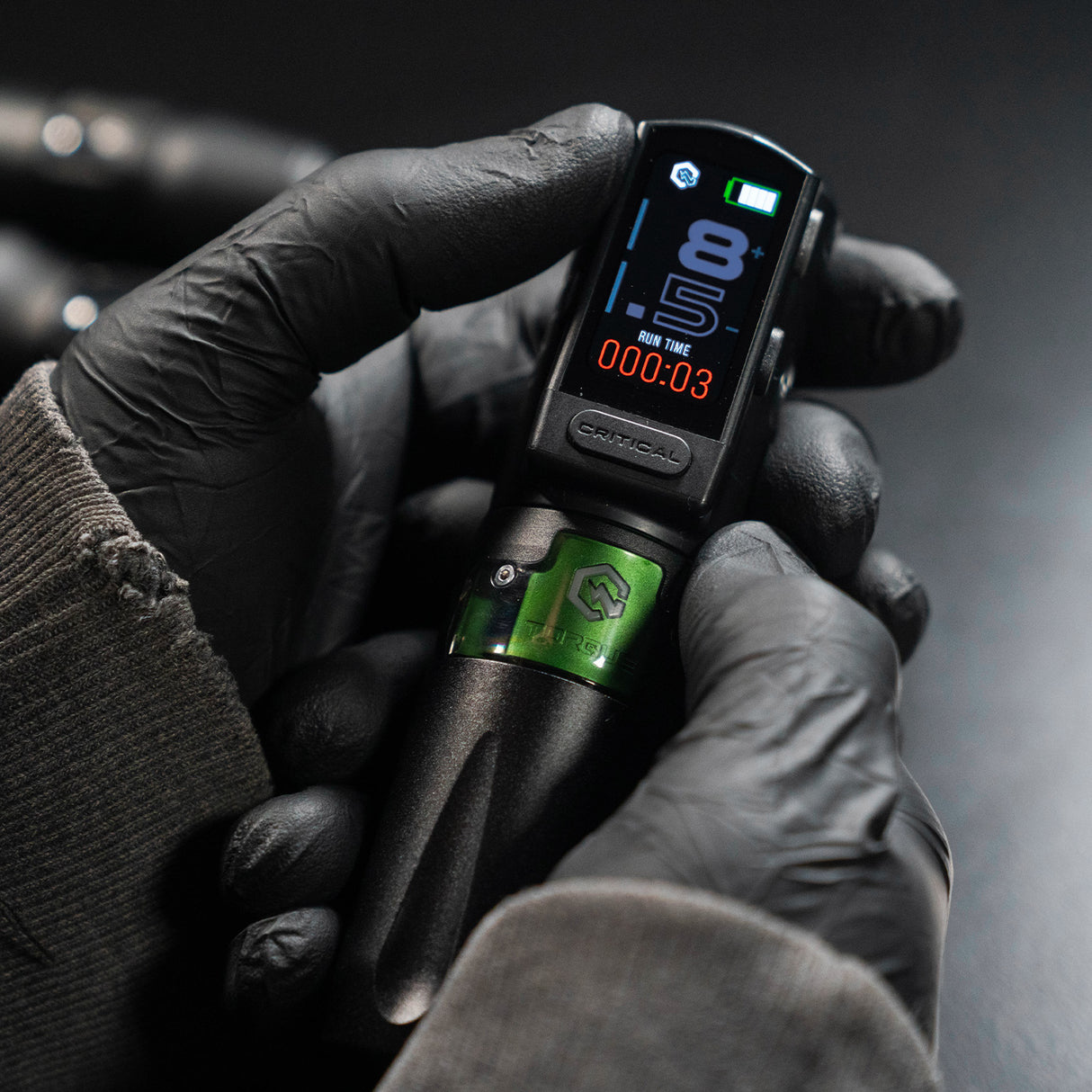 Critical Torque Wireless Tattoo Machine Ultimate Bundle with multiple needle configurations, showcasing the sleek tattoo device in black.