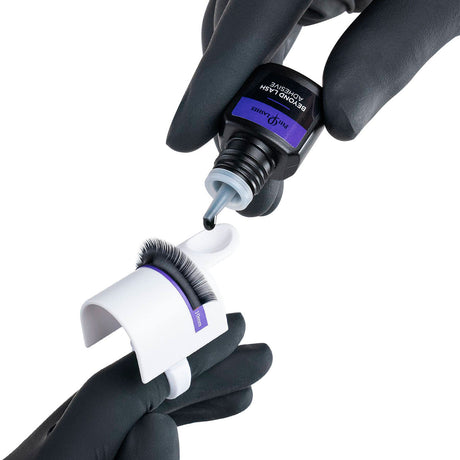 PhiLashes Beyond Lash Adhesive — adhesive being dispensed into a ring cup