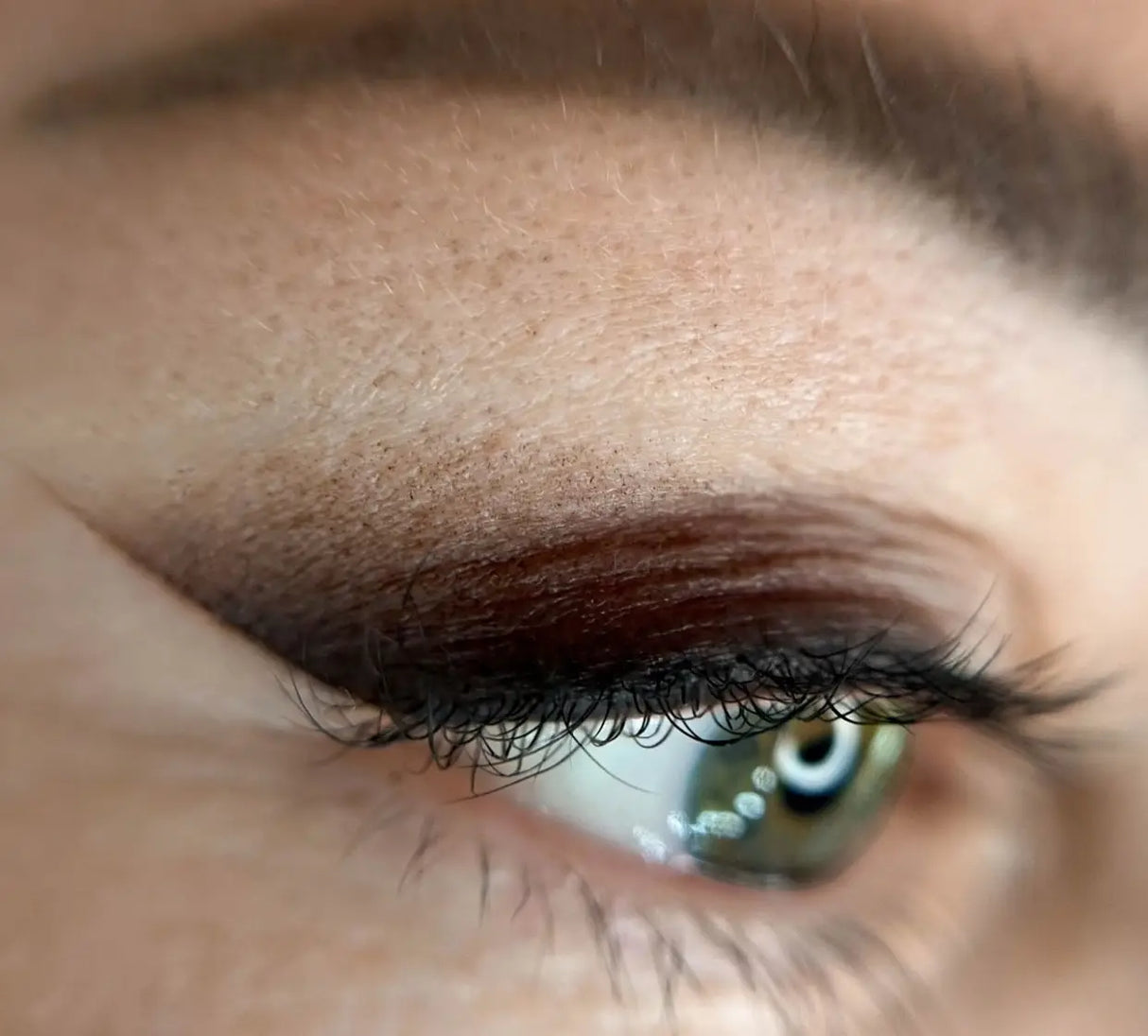 Close-up of Antonina Andrusenko's macro lens, showing detailed lens elements and brand markings on BVShop product image.