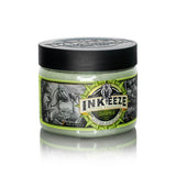 Inkeeze x Matt Jordan Taramea tattoo ointment in a 150g jar, with product label visible and cosmetic packaging.