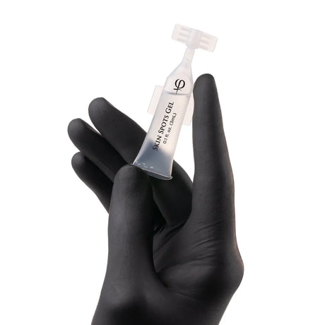 PhiAcademy Skin Spots Gel 3ml 5pcs — individual Skin Spots Gel ampoule held in a gloved hand
