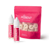 The Pigment Aftercare Bundle includes skincare products with branding, designed for tattoo or pigment aftercare.